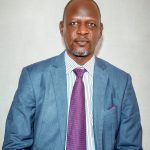 Mr. Christopher Eporon Ekuwom, MBA, MSc, BA